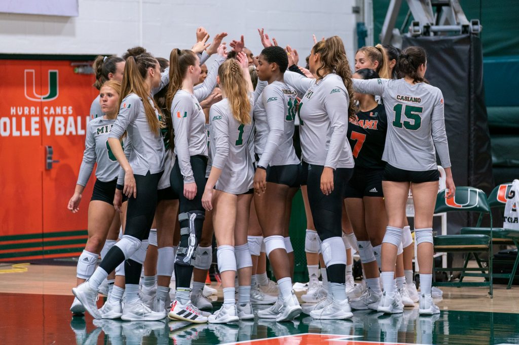 ‘Canes volleyball players huddle before the start of the second set of their match versus the University of South Carolina in the Knight Sports Complex on Sept. 16, 2022.