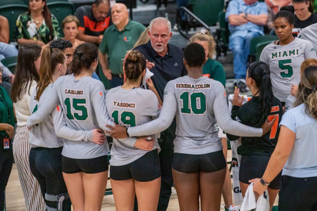 Head coach Jose “Keno” Gandara speaks to his team during a timeout in the fifth set of Miami’s match versus the University of South Carolina in the Knight Sports Complex on Sept. 16, 2022.
