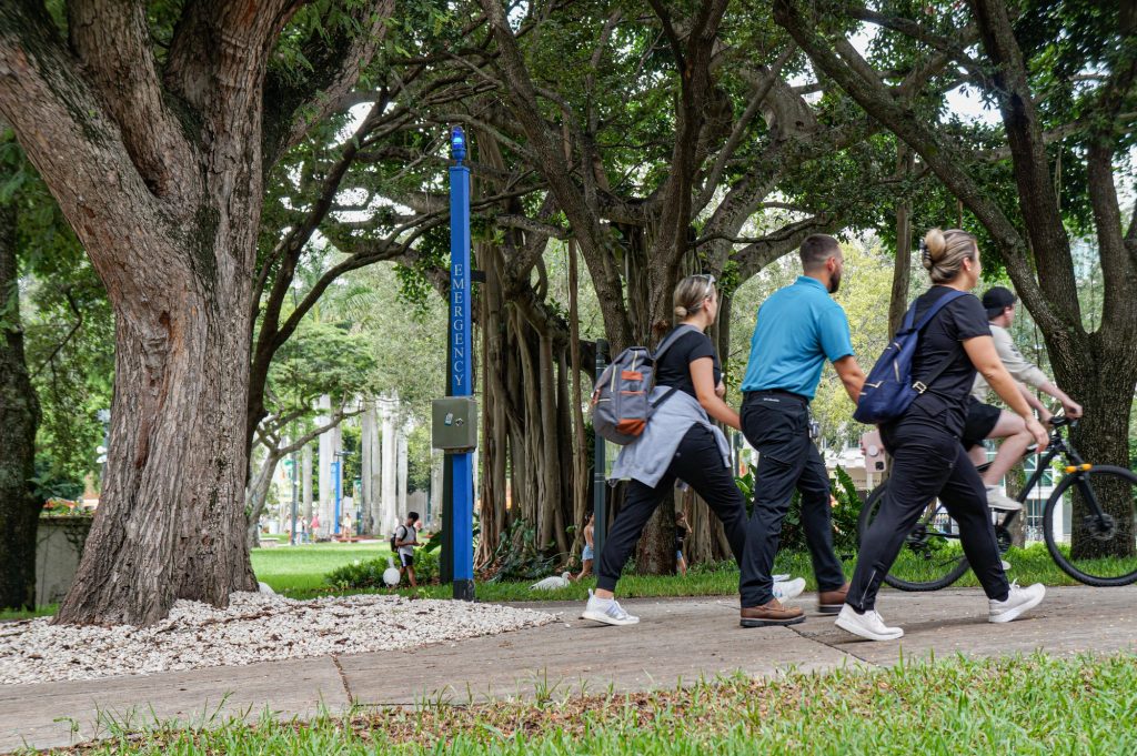 Students walk past police blue light phones on Sept. 19.