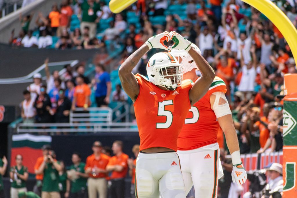Third-year sophomore wide receiver Key'Shawn Smith holds up a heart following his points against Southern Miss on Sept. 10 at Hard Rock Stadium.