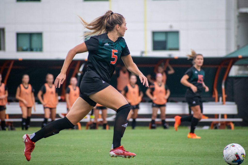 Sophomore defender Claire Llewellyn runs the ball down the field during Miami's win against North Florida on Aug. 28 at Cobb Stadium.