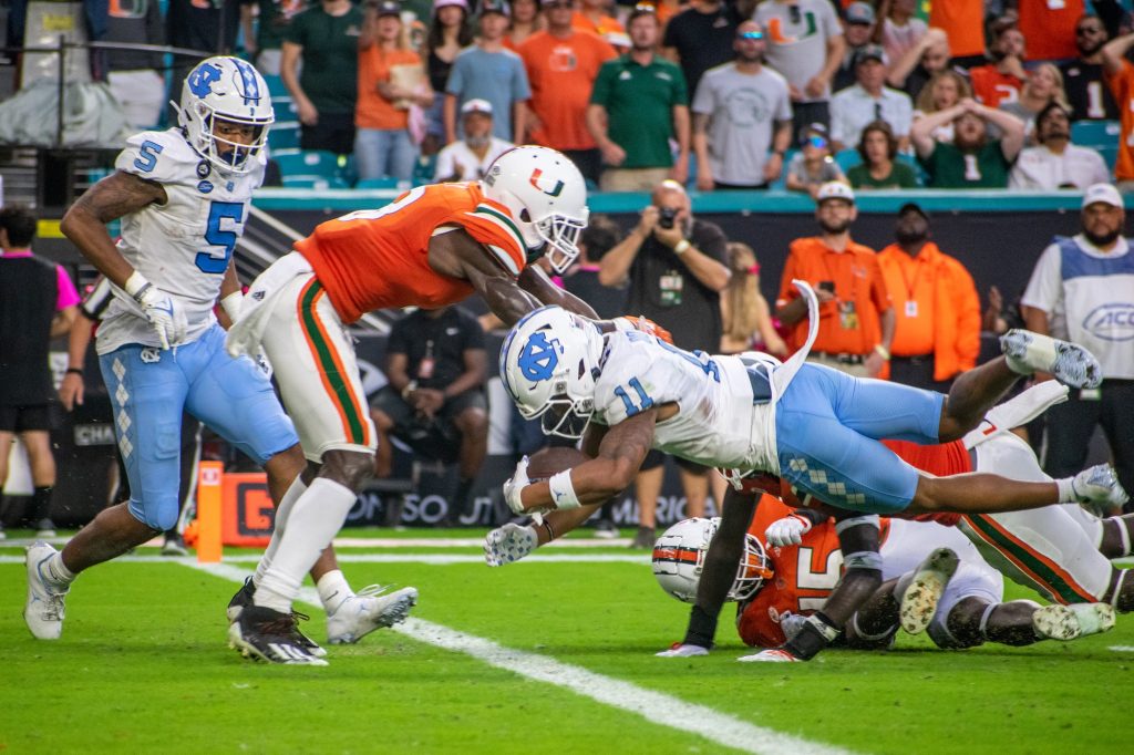 The 'Canes attempt to stop the University of North Carolina on the goal line during Miami's loss on Saturday, Oct. 8 at Hard Rock Stadium.