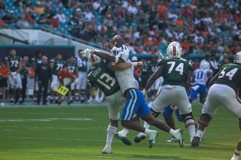 Redshirt freshman quarterback Jake Garcia gets tackled by a Duke player during Miami's 45-21 loss on Saturday, Oct. 22 at Hard Rock Stadium.