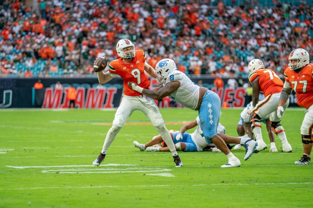Third-year sophomore quarterback Tyler Van Dyke throws a pass for a touchdown during the second quarter of Miami’s game versus the University of North Carolina at Hard Rock Stadium on Oct. 8, 2022.