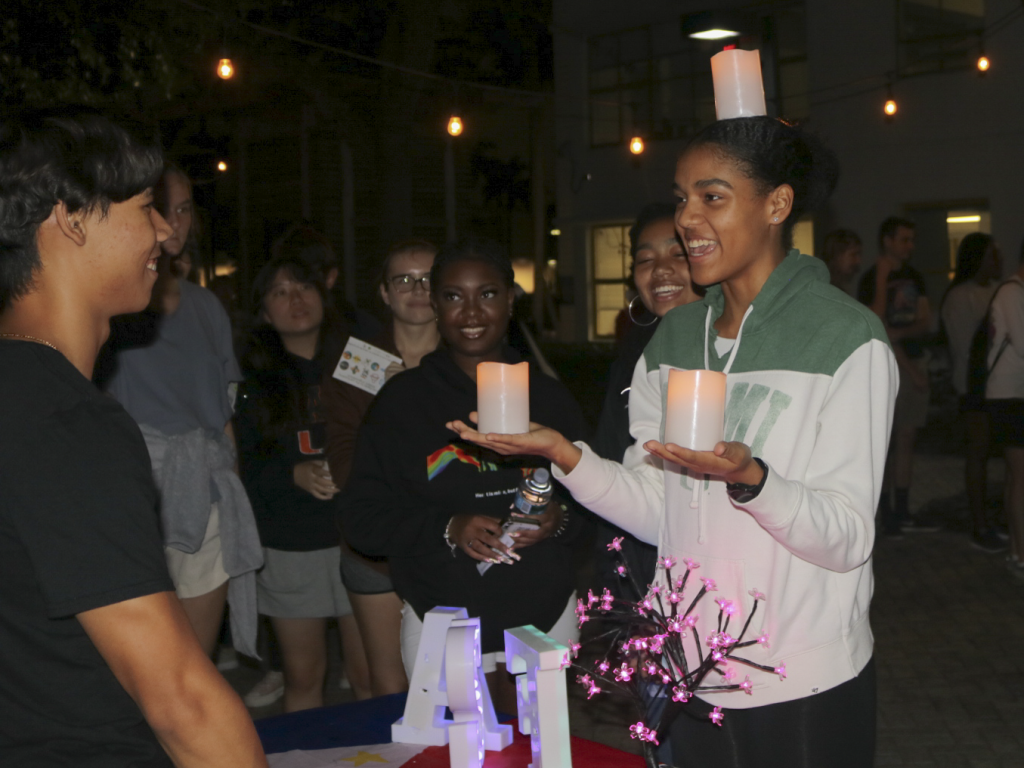 A student holds up three candles at the AASA Lantern Festival on Oct. 21 in the architecture courtyard.