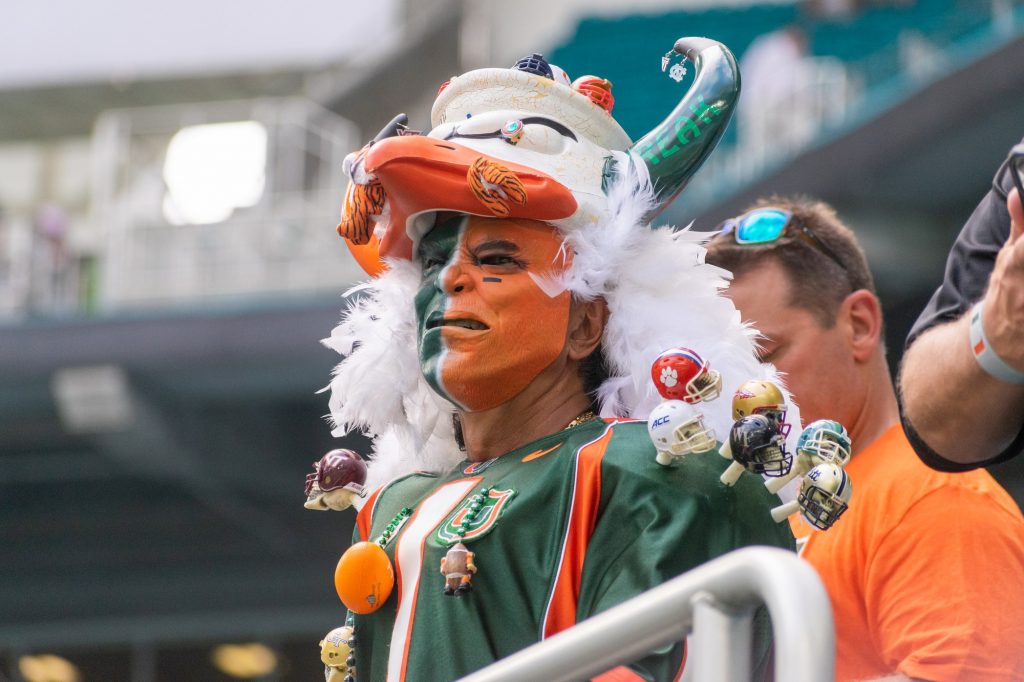 A fan dresses up and prepares to cheer on the canes during Miami's ACC opener against the University of North Carolina on Saturday, Oct. 8 at Hard Rock Stadium.