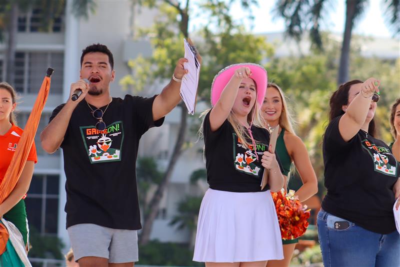 Members of the Homecoming Executive Committee lead students in a cheer during one of the events.