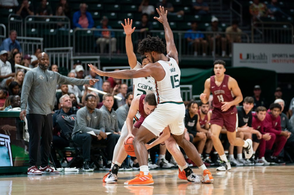 Third-year sophomores forward Norchad Omier and guard Nijel Pack lock down a Lafayette player and force a timeout during the second half of Miami’s game versus Lafayette in the Watsco Center on Nov. 7, 2022.