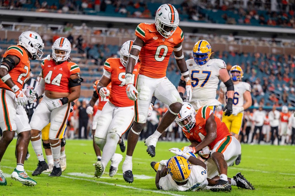 Sophomore safety James William jumps over a University of Pittsburgh running back during Miami's 42-16 loss on Saturday, Nov. 26 at Hard Rock Stadium.