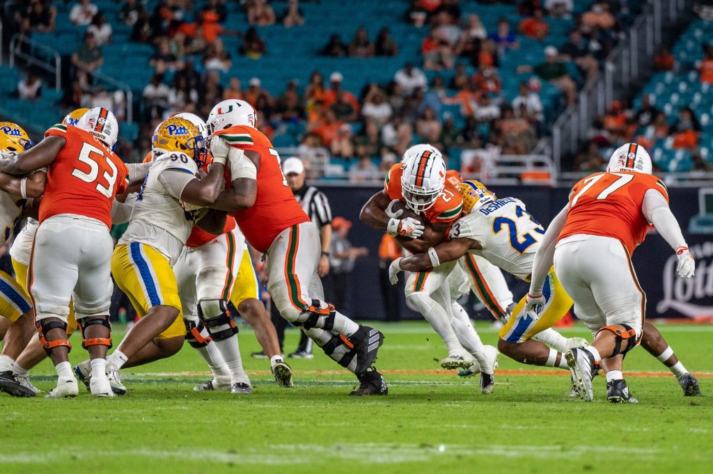 Third-year sophomore running back Henry Parish Jr. gets tackled during Miami's game versus the University of Pittsburgh on Saturday, Nov. 26 at Hard Rock Stadium.