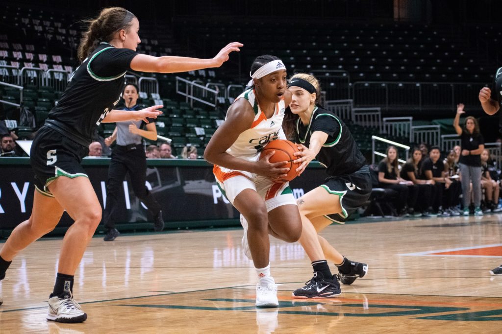 Sophomore guard Lashae Dwyer protects the ball during Miami's game against Stetson University on Thursday, Nov. 10 at the Watsco Center.