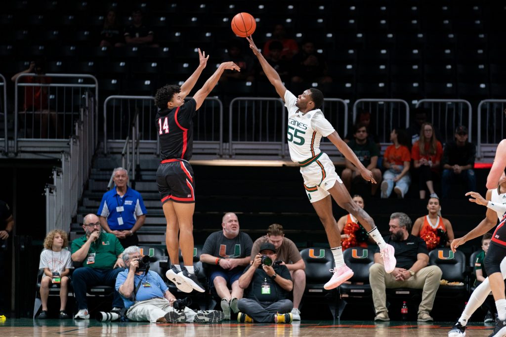 Sophomore guard Wooga Poplar reaches to block a jump shot during the first half of Miami’s game versus St. Francis University in the Watsco Center on Dec. 17, 2022.