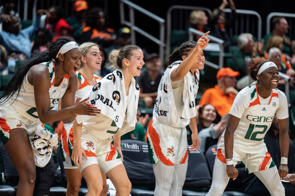 Miami players cheer on their teammates during the second half of Miami's game versus the University of North Florida on Sunday, Dec. 4 at the Watsco Center.