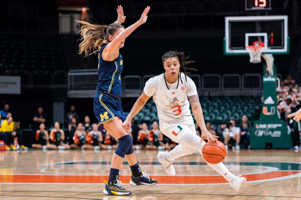 Graduate student forward Destiny Harden runs around a defender during Miami's 64-76 loss to the University of Michigan on Thursday, Dec. 1 at the Watsco Center.