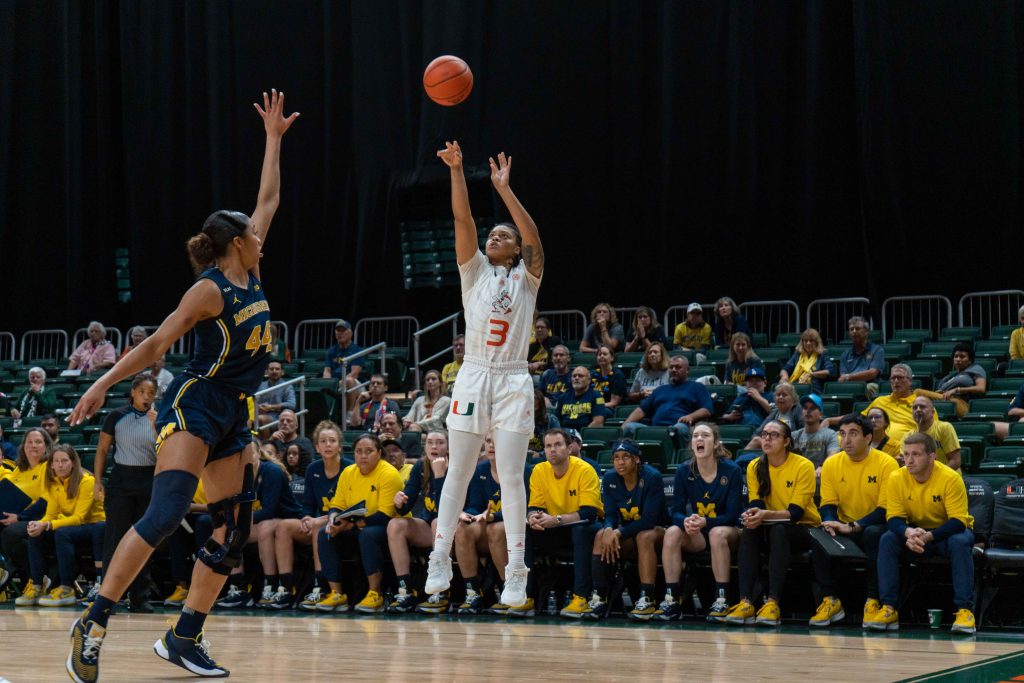 Graduate student forward Destiny Harden shoots a 3-point shot during Miami’s game against Michigan on Friday, Dec.1 at the Watsco Center.