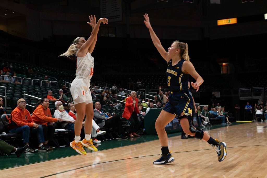 Senior guard Haley Cavinder shoots a shot past a defender during Miami’s game versus the University of Michigan on Thursday, Dec.1 at the Watsco Center