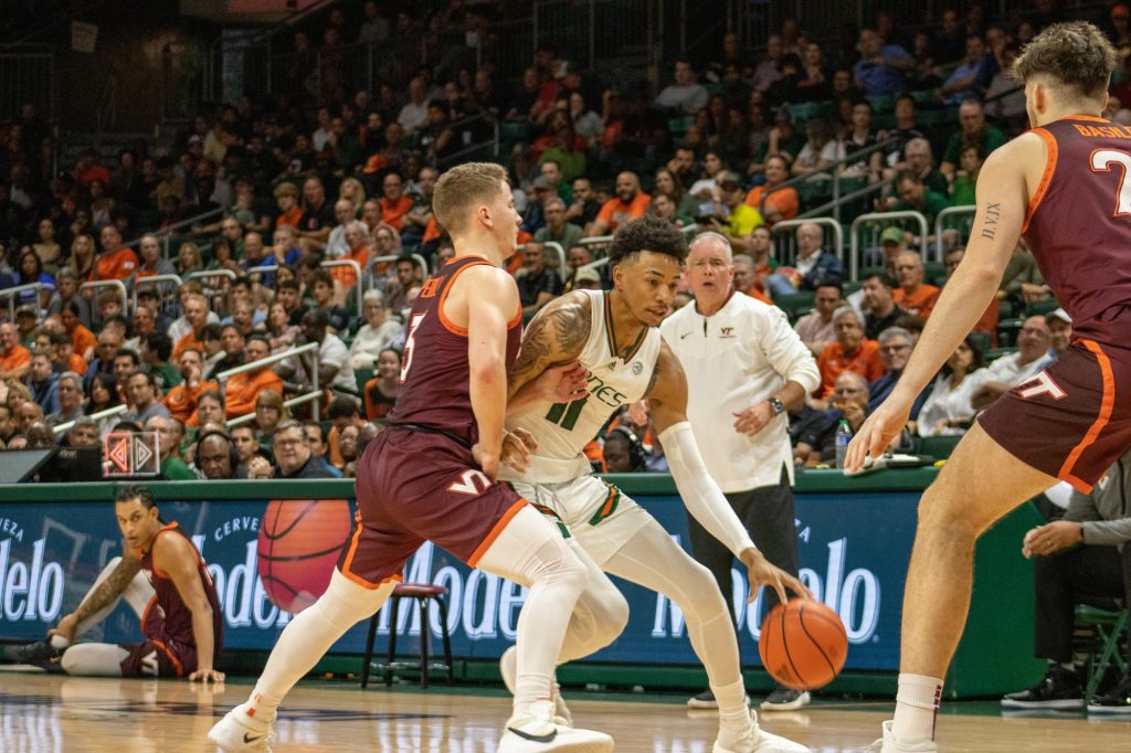 Fifth-Year Senior Jordan Miller protects the ball against Virginia Tech at the Watsco Center on January 31.