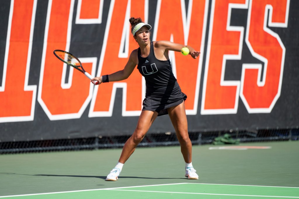 Fifth-year senior Daevenia Achong prepares to hit the ball during Miami's matchup against Iowa State University on Sunday, Jan. 29 at the Neil Schiff Tennis Center.
