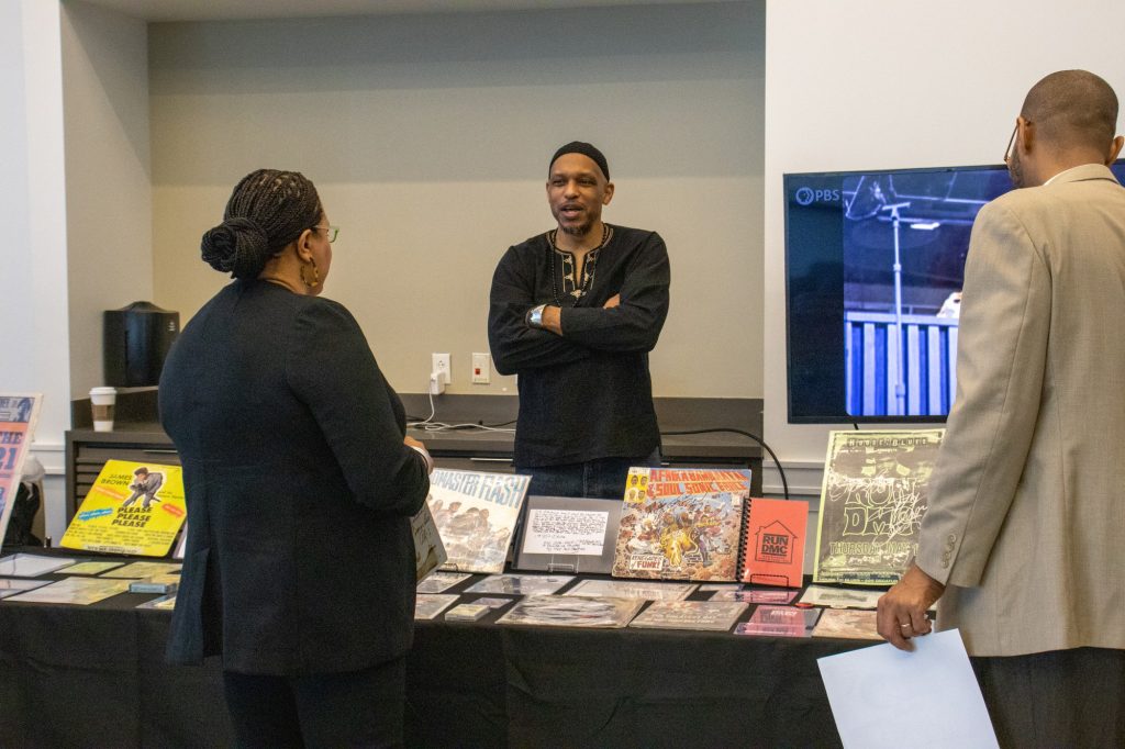 Dr. Khalid el-Hakim talks about the Black History Mobile Musuem with visitors and shares the stories behind the artifacts on display at the Shalala Student Center on Feb. 9.