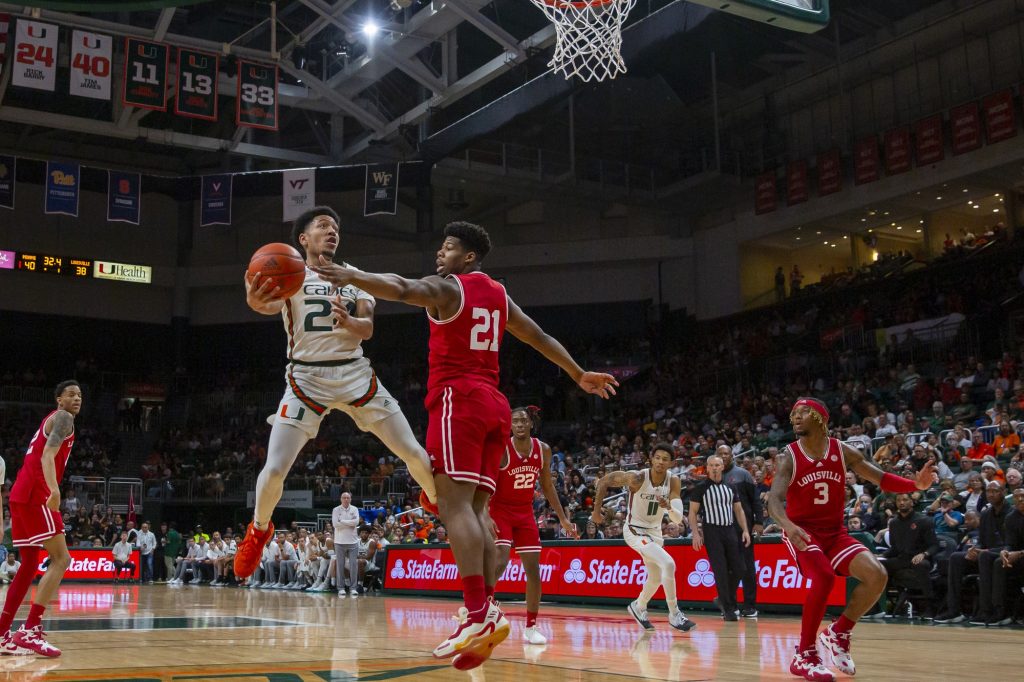 Third-year sophomore guard Nijel Pack attempts a layup against the University of Louisville during Miami’s win over the Cardinals at the Watsco Center on Saturday, Feb. 11.