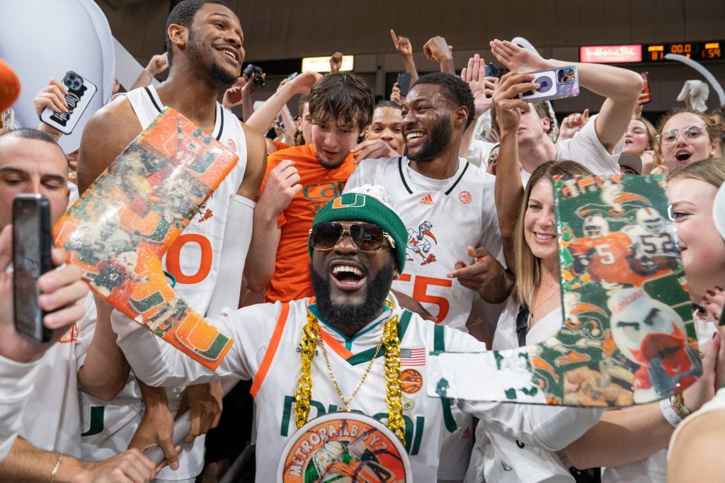 ‘Canes players celebrate in the Category 5 “Eye” student section following their 81-59 win over Duke in the Watsco Center on Feb. 6, 2023.