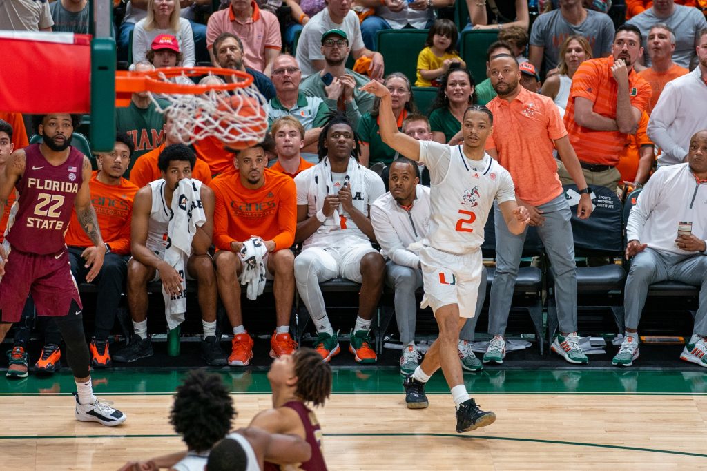 Fourth-year junior guard Isaiah Wong makes a three-pointer during the second half of Miami’s game versus Florida State in the Watsco Center on Feb. 25, 2023.