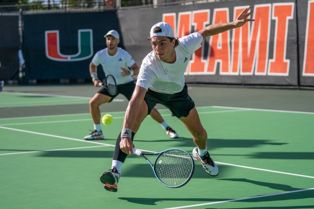 Fifth-year senior Franco Aubone returns the ball during the seventh game of his doubles match at the Neil Schiff Tennis Center on Feb. 10, 2023.
