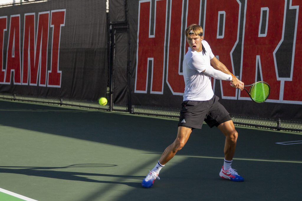 Graduate Student Leonard Bierbaum returns the ball during Miami’s matches against the Ospreys at the Neil Schiff Tennis Center on Friday, Feb. 10.