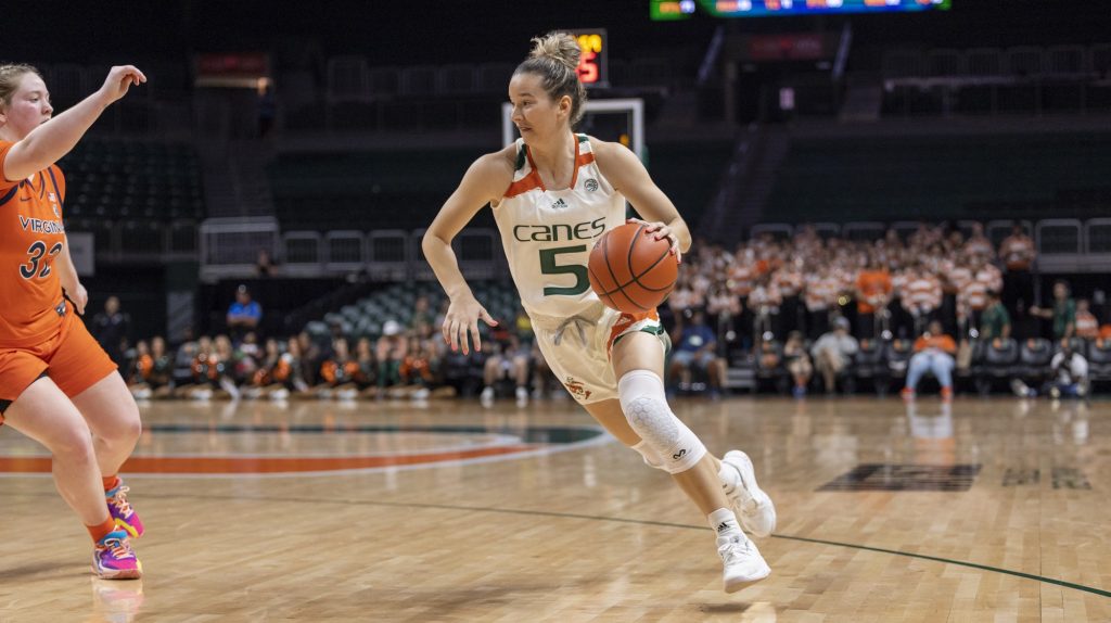 Graduate student guard Karla Erjavec drives the ball towards the net during the fourth quarter of Miami’s senior day game against UVA at the Watsco Center on Sunday, Feb. 26.