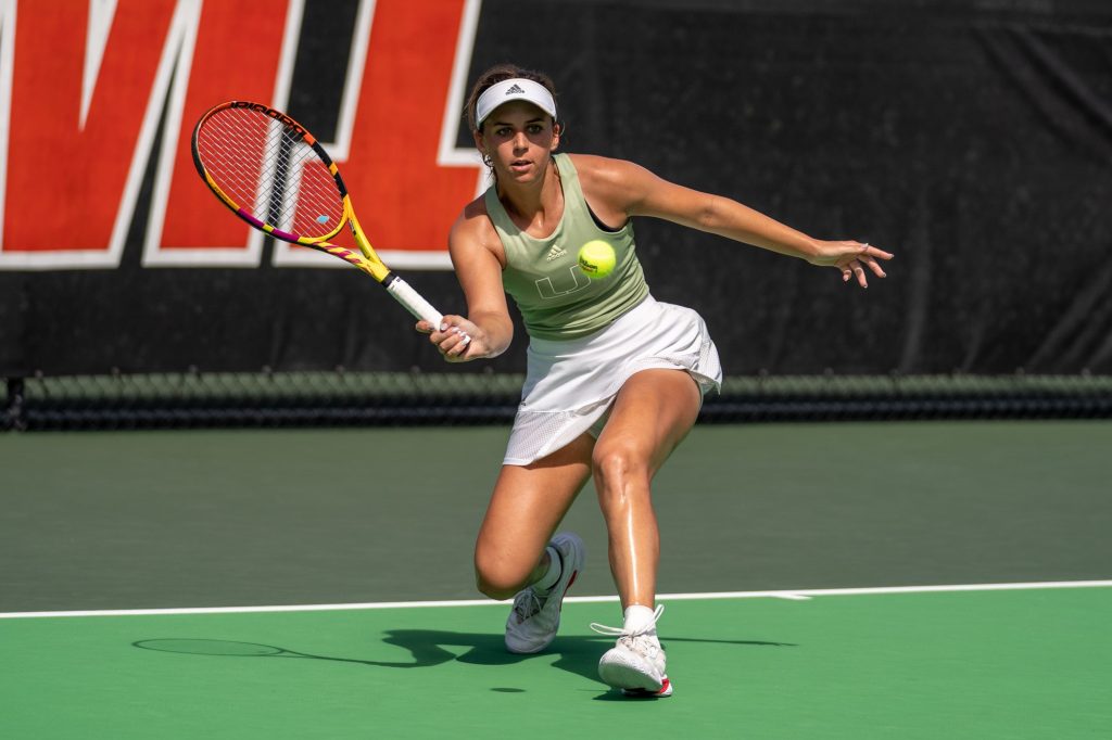 Junior Audrey Both-Collins returns the ball during the first game of the second set of her singles match at the Neil Schiff Tennis Center on Feb. 11, 2023.