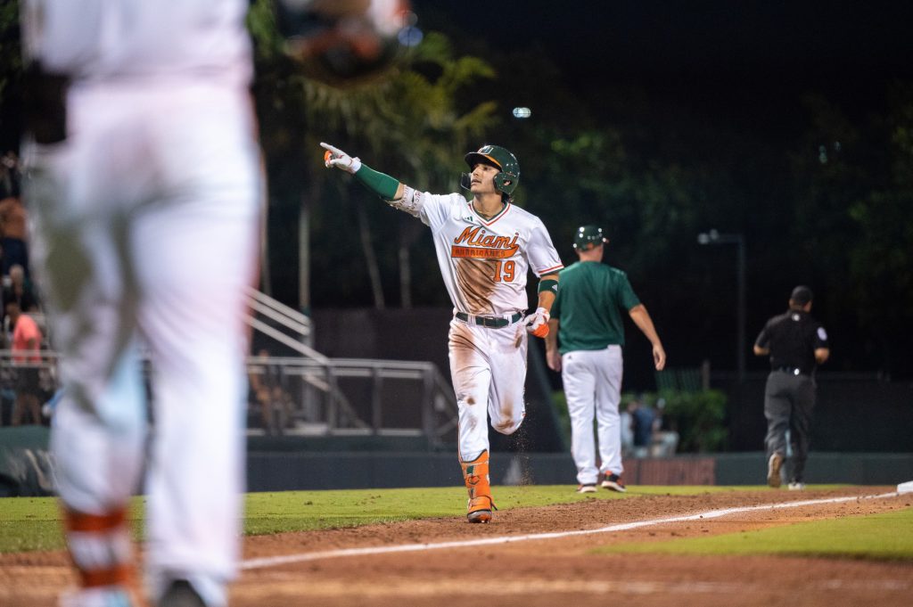 Junior infielder Dominic Pitelli points to the crowd following a homerun hit during Miami's game against Penn State University on Friday, Feb. 17 ath Mark Light Field.