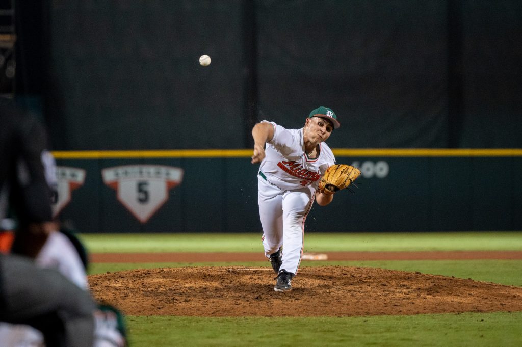 Redshirt sophomore right-handed pitcher Alejandro Torres throws the ball during Miami's loss to Penn State University on Friday, Feb. 17 at Mark Light Field.