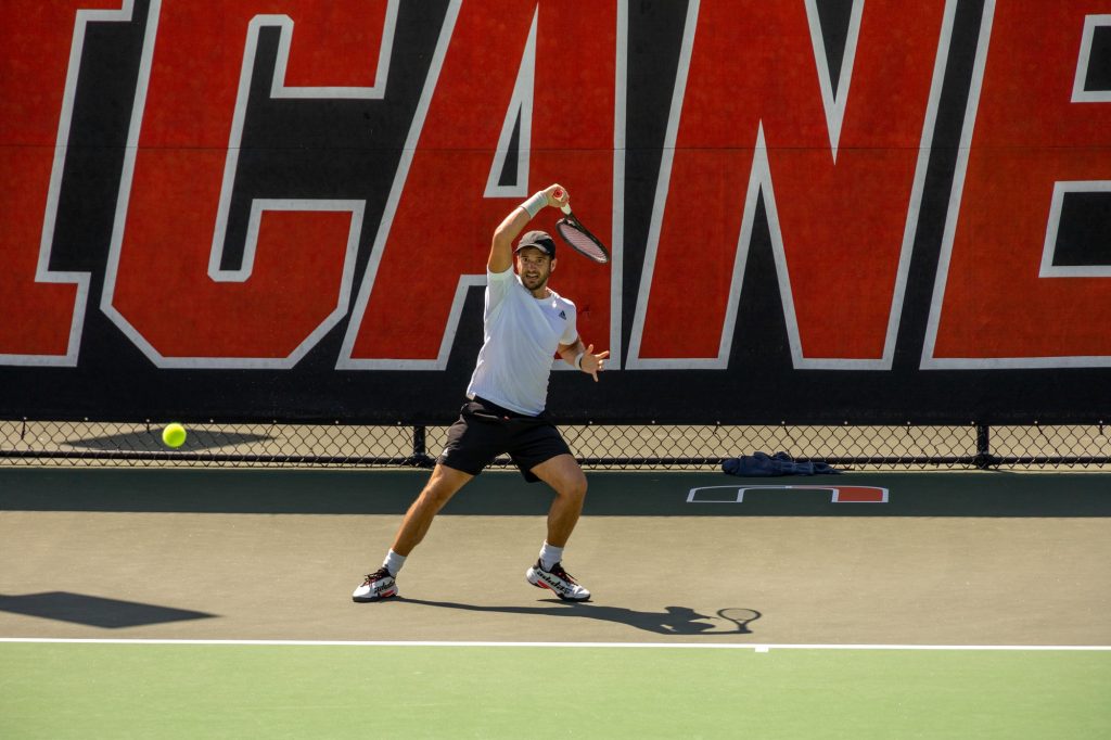 Graduate student Dan Martin returns the ball during Miami’s matches against South Alabama at the Neil Schiff Tennis Center on Wednesday, March 8.