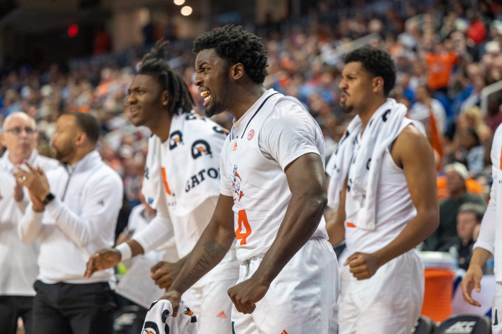 Sophomore guard Bensley Joseph cheers on the 'Canes during their semifinal game of the ACC tournament against Duke University on March 10 at the Greensboro Coliseum Complex.