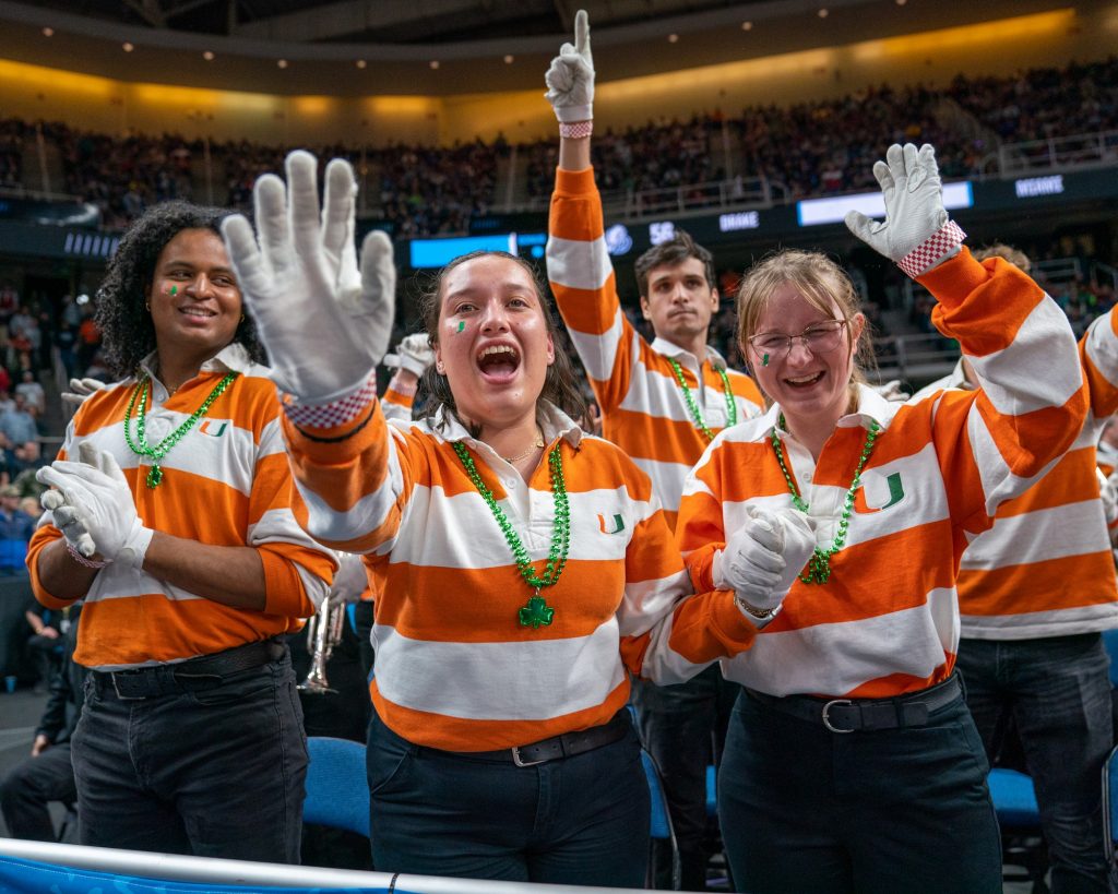 Members of the Frost Band of the Hour celebrate Miami’s late-game comeback in their Round of 64 matchup with Drake University in the MVP Arena in Albany, NY on March 17, 2023.