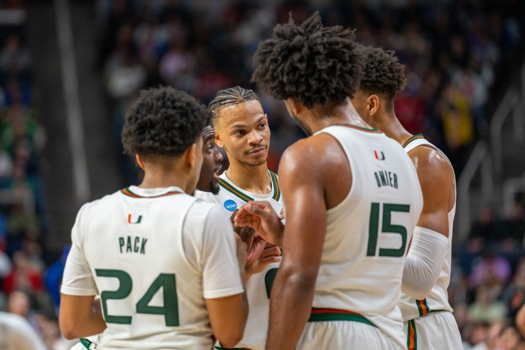 ‘Canes Basketball Players huddle during the second half of Miami’s Round of 64 matchup against Drake University in MVP Arena in Albany, N.Y. on March 17, 2023.