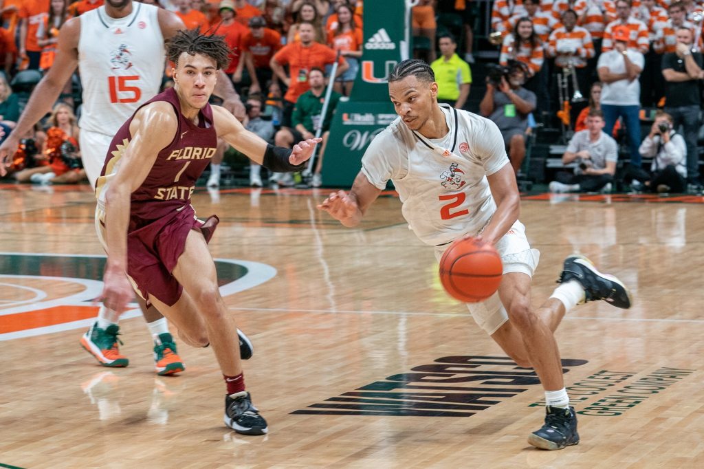 Fourth-year junior guard Isaiah Wong drives past a defender during the second half of Miami’s game versus Florida State in the Watsco Center on Feb. 25, 2023.