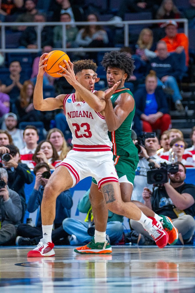 Third-year sophomore Norchad Omier guards fourth-year junior forward Trayce Jackson-Davis during the second half of Miami’s Round of 32 matchup against Indiana University in MVP Arena in Albany, N.Y. on March 19, 2023.