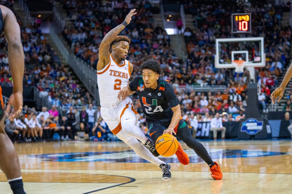 Third-year sophomore guard Nijel Pack drives to the basket during the first half of Miami’s Elite Eight matchup against the University of Texas in the T-Mobile Center in Kansas City, MO on March 26, 2023.
