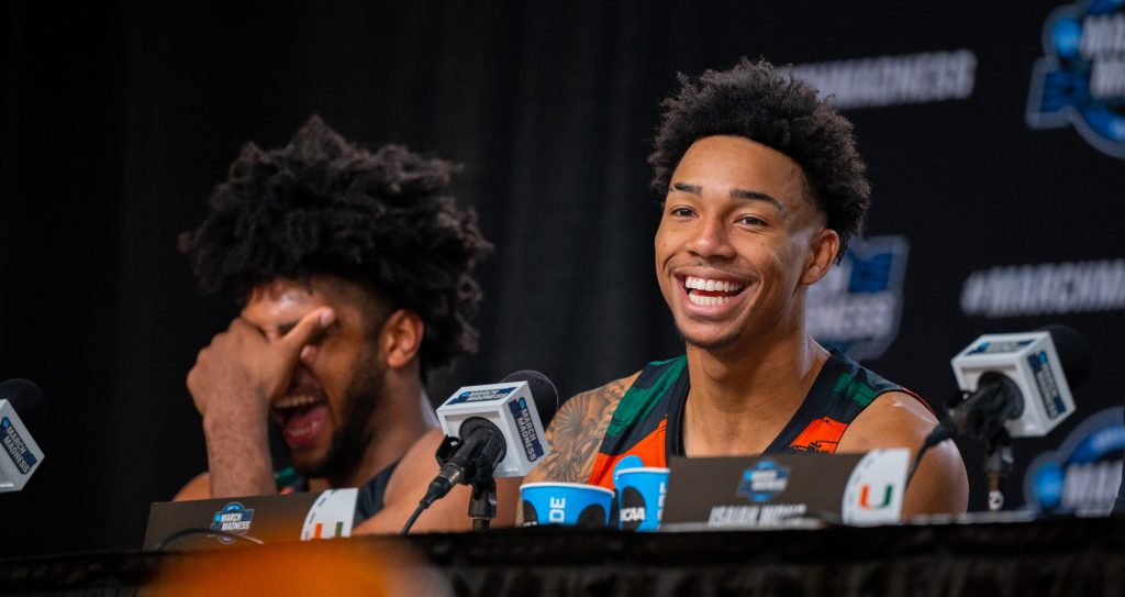 Fifth-year senior guard Jordan Miller laughs alongside Norchad Omier following Miami's Sweet Sixteen win over the University of Houston on Friday, March 24 at the T-mobile Arena.