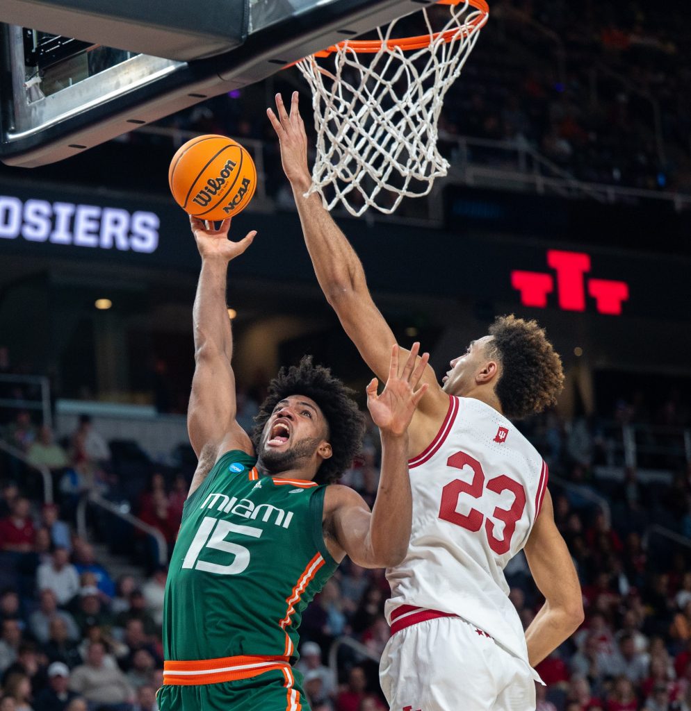 Third-year sophomore Norchad Omier throws the ball for a layup during the second half of Miami's Round of 32 game against Indiana University on Sunday, March 19 at the MVP Arena.