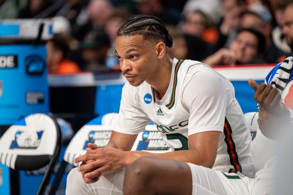 Fourth-year junior guard Isaiah Wong looks on from the bench during Miami's first round game against Duke Universit on Friday, March 17 at the MVP Arena.