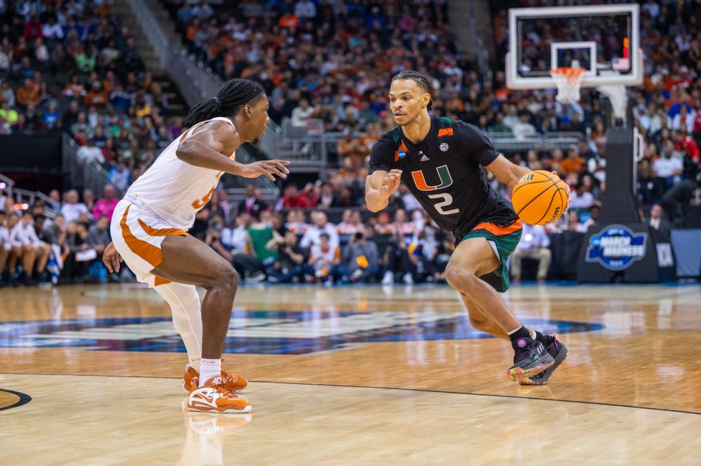 Fourth-year junior guard Isaiah Wong drives to the basket during Miami's Elite Eight win over the University of Texas on Sunday, March 26 at the T-Mobile Center.