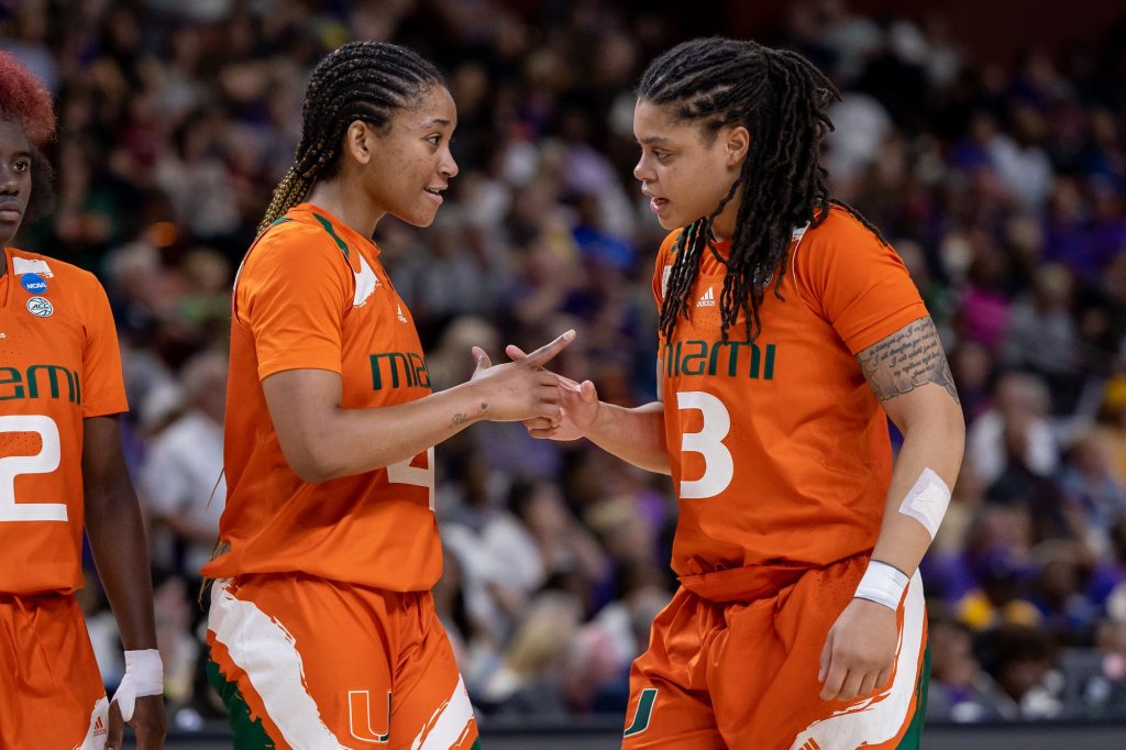 Jasmyne Roberts and Destiny Harden support each other during the fourth quarter of Miami’s first ever Elite Eight matchup against LSU in the Bon Secours Arena on Sunday, March 26.