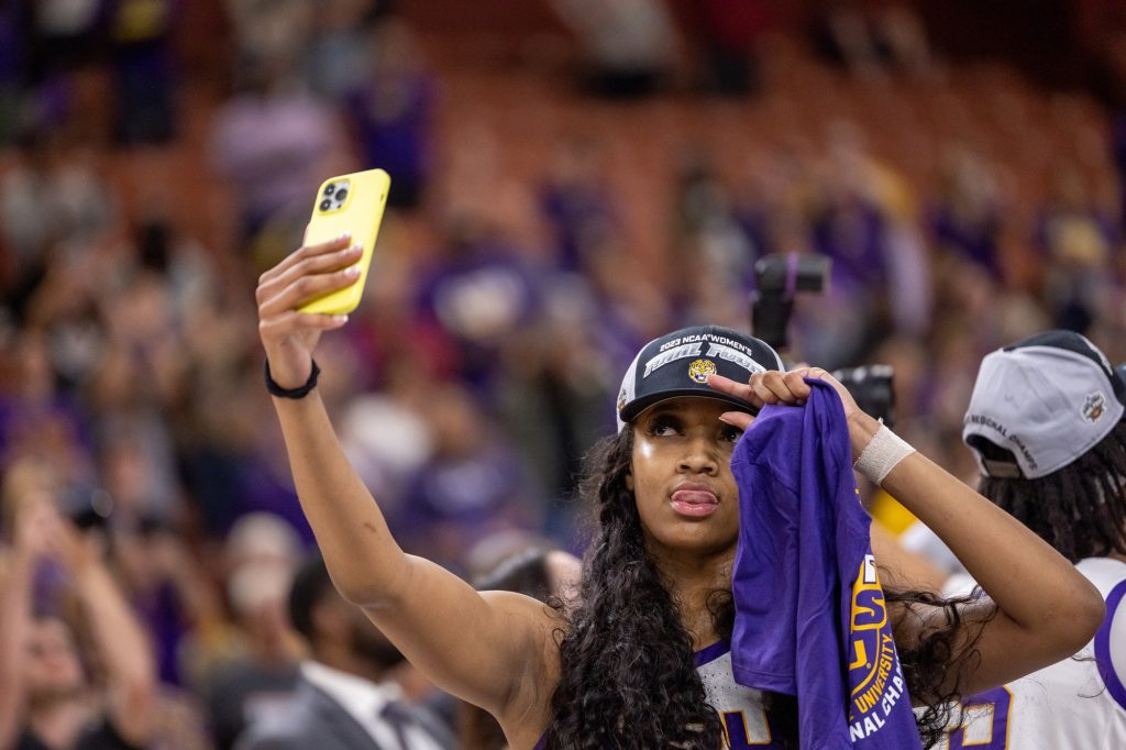 LSU star Angel Reese poses for a selfie after defeating Miami in their Elite Eight matchup in the Bon Secours Arena on Sunday, March 26.