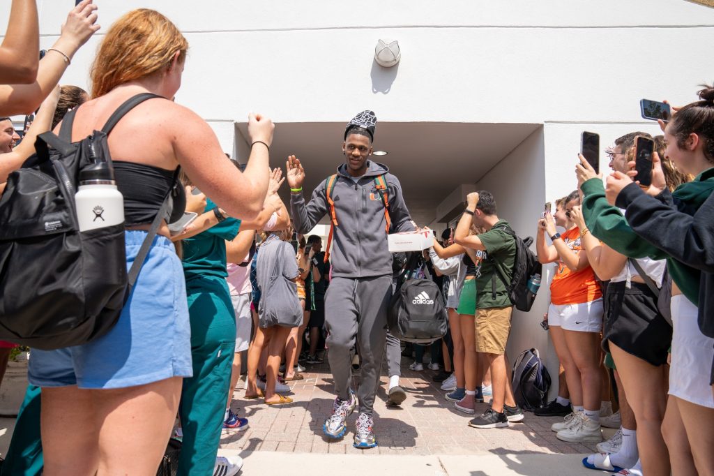 Freshman guard Christian Watson walks to the team bus outside of the Watsco Center during the Miami Final Four Sendoff on March 29, 2023.