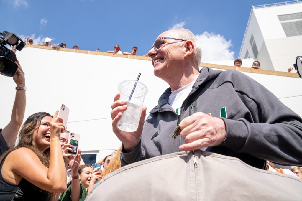 Head coach Jim Larrañaga greets fans as he walks to the team bus outside of the Watsco Center during the Miami Final Four Sendoff on March 29, 2023.