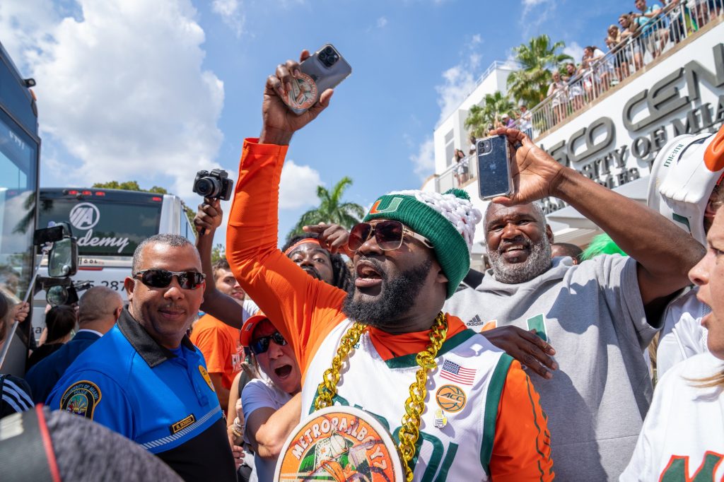 ‘Canes superfan “JD Da Boss” cheers outside of the Watsco Center during the Miami Final Four Sendoff on March 29, 2023.