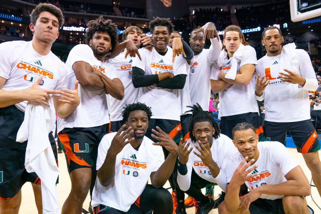‘Canes basketball players pose after their 88-81 Elite Eight win over the University of Texas in the T-Mobile Center in Kansas City, MO on March 26, 2023.