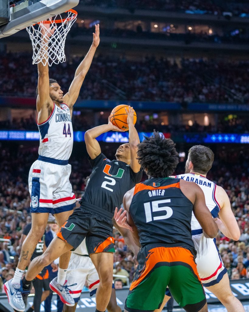 Fourth-year junior guard Isaiah Wong shoots during the first half of Miami’s Final Four matchup against the University of Connecticut in NRG Stadium in Houston on April 1, 2023.
